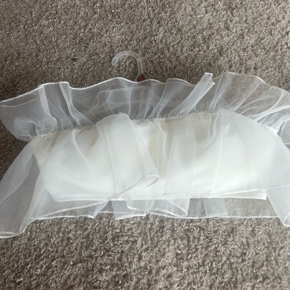 White ruffled pants suit